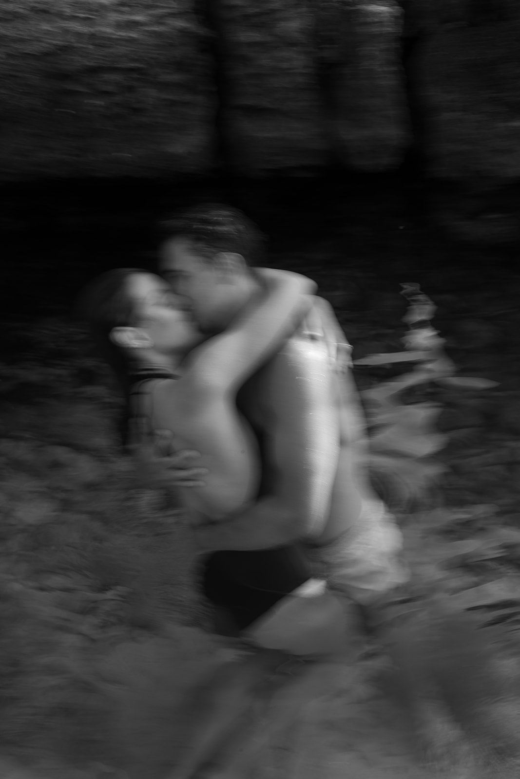 Bride and groom in elopement day in Menorca hug each other in the water, taken by Sus Pons