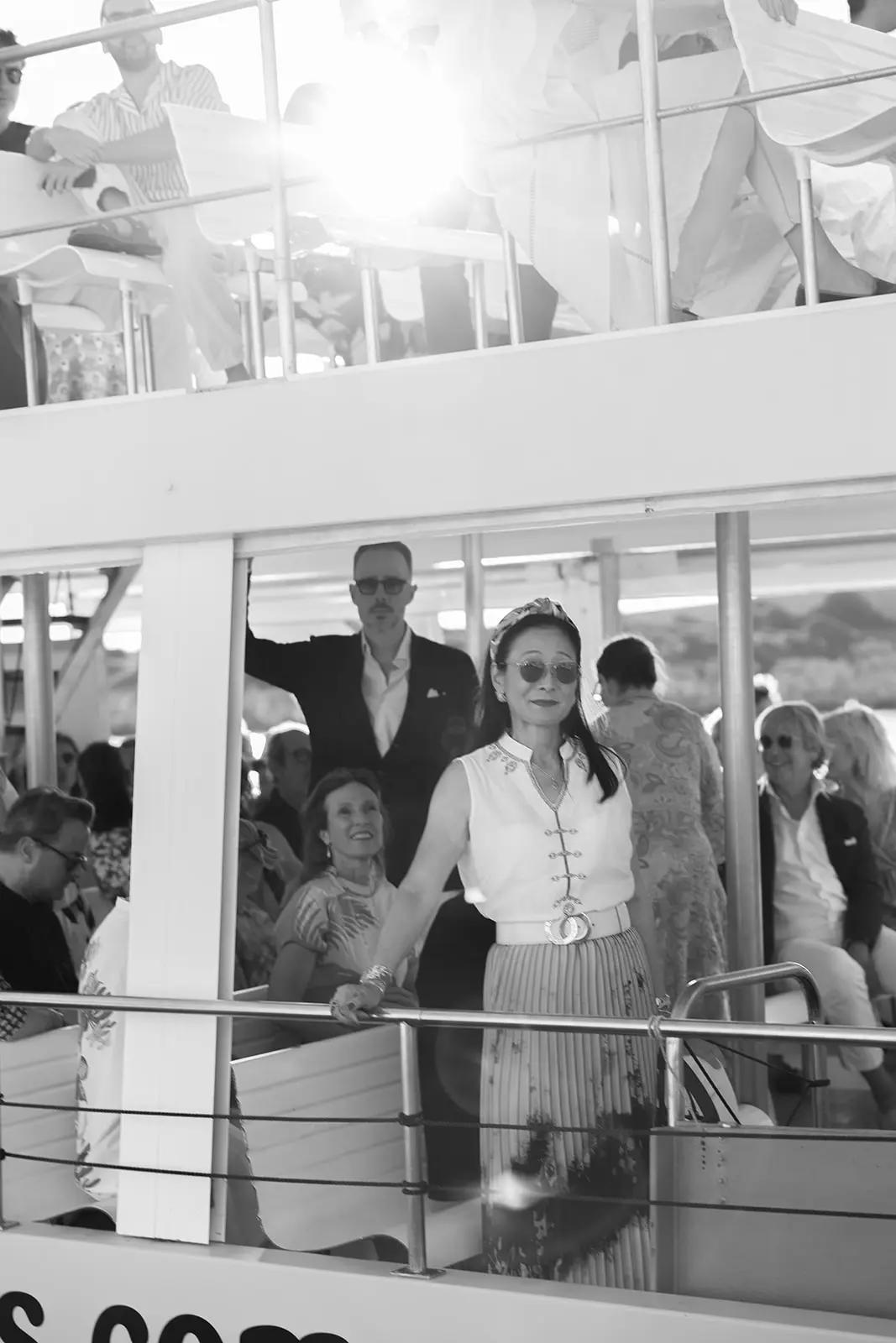 Wedding guests arriving by boat in Menorca, part of a destination wedding celebration on the island